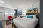 Furnished Living Room and Bedroom - Corporate Apartments - Chic Premium Studios On 25th