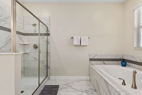 Master bathroom 1 with walk in shower and separate bathtub