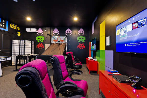 The game room has 4 gaming chairs where you can play either PS4 or Xbox One along with a Foosball table