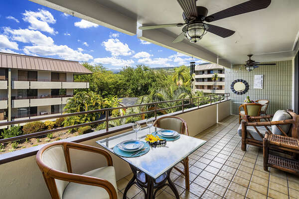 Lanai with Outdoor Dining Set for Two, Sofa, and Ceiling Fan