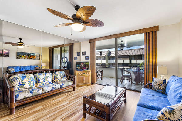 Living Area with Easy Access to Lanai, Sofas, TV, and Ceiling Fan