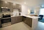 Modern Kitchen with Whirlpool Stainless Steel Appliances - Corporate Housing Atlanta - 1-Bedroom Spectacular Suites