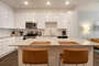Fully Equipped Kitchen with Island Bar Seating - BCA Furnished Apartments - 1-Bedroom Spectacular Suites
