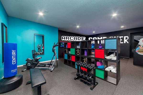 The game room doubles as a home gym