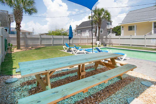 Absolute Paradise vacation home on a channel of the Cherry Grove Inlet in North Myrtle Beach | picnic table | Thomas Beach Vacations