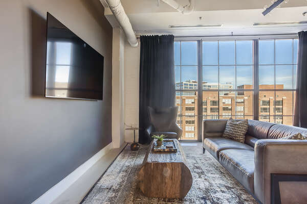 Living Area with HD-TV, Leather Sofa, and City Views