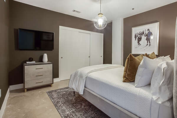 Guest Bedroom with Flat Screen TV and Contemporary Furnishings