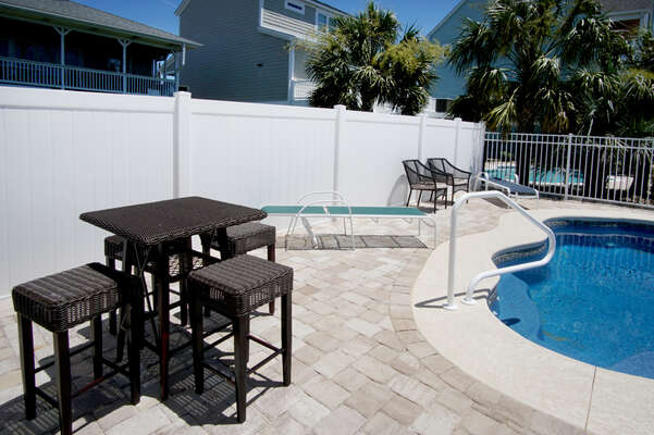 5 O'Clock Poolside - waterfront vacation home on a channel of the Cherry Grove Inlet in North Myrtle Beach | pool 3 & table | Thomas Beach Vacations