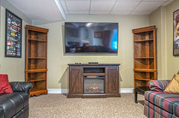 Large Flat Screen TV Mounted in the Lower Level Family Room