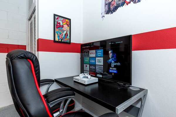 Gamers will love the gaming setup with two video game chairs, an Xbox and 42 inch TV complete with a Roku