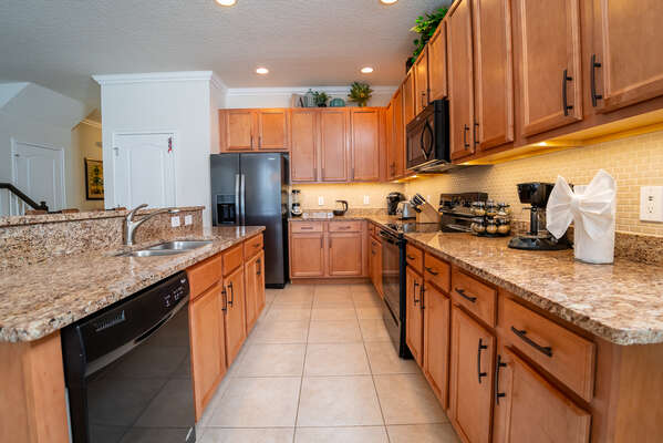 Large galley style kitchen with plenty of cabinet and counter space