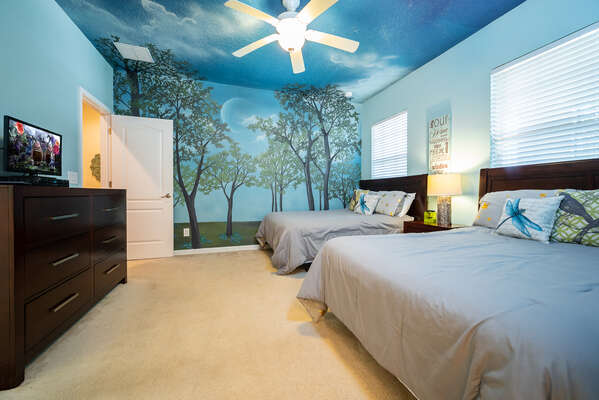 bedroom 6 has a serene forest theme with 2 full size beds