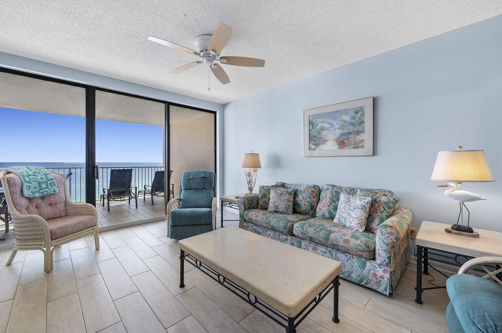 Spacious Living Area offers plenty of comfortable seating and Access to the Balcony