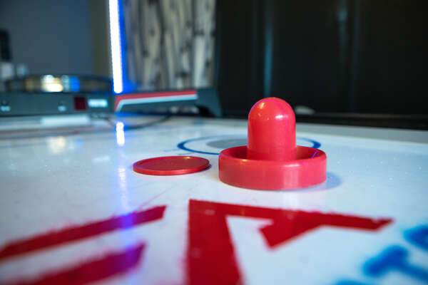 Create an air hockey tournament, winner gets to choose the family movie to watch!
