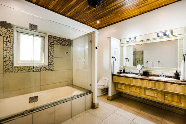 #2 Master suite – His and Hers double sink bathroom, each with its own side, and a bath tub.