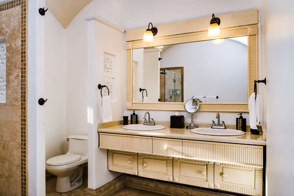 #1 Master suite – His and Hers double sink bathroom, each with its own side, and a spacious, modern shower.