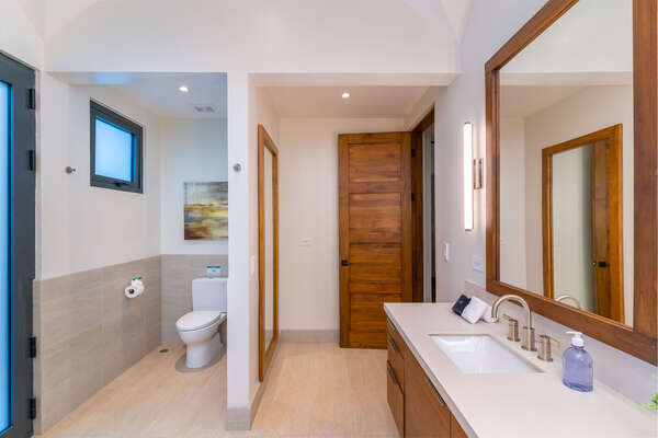 Complete your comfort with a toilet in the master bathroom for added convenience.