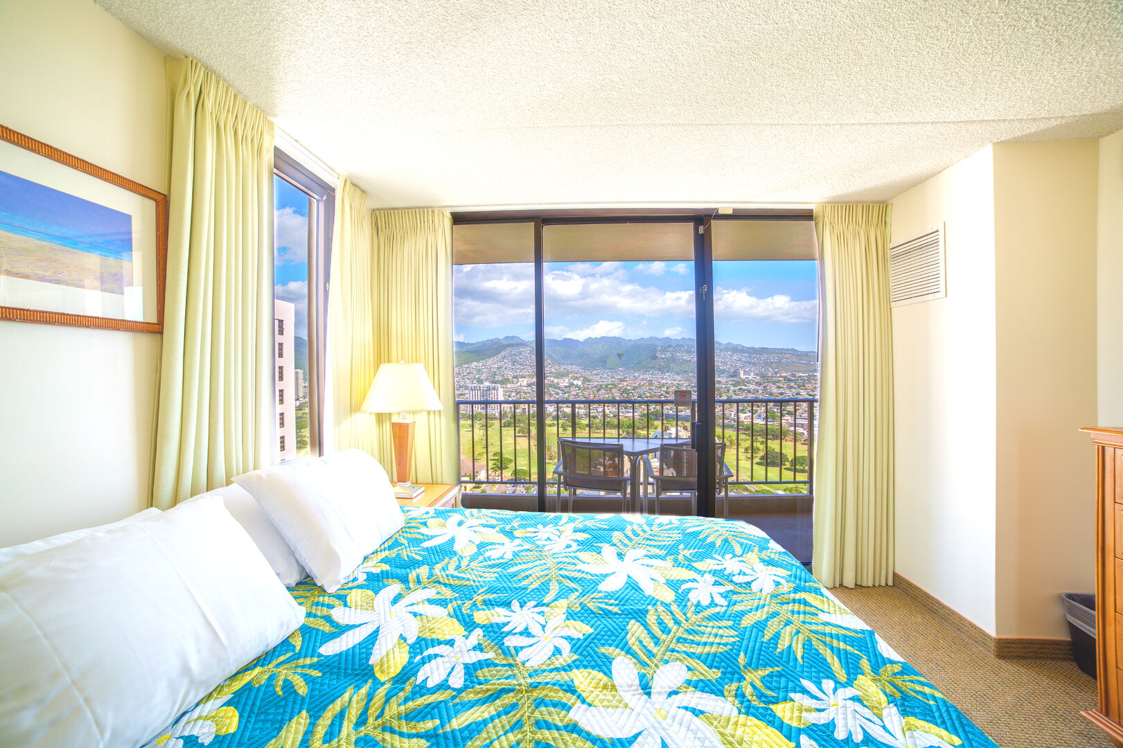 Bedroom with beautiful mountain and city views, king-size bed and TV