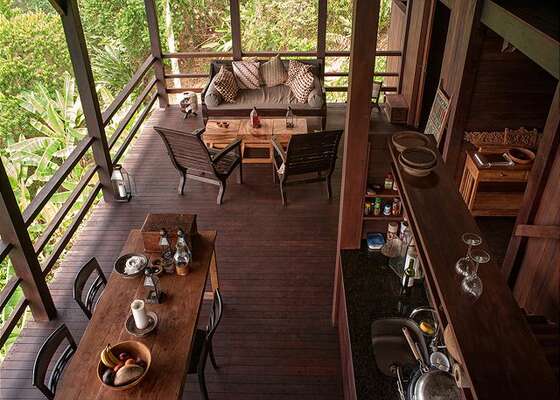 Open air home with sitting area, dining table, kitchen