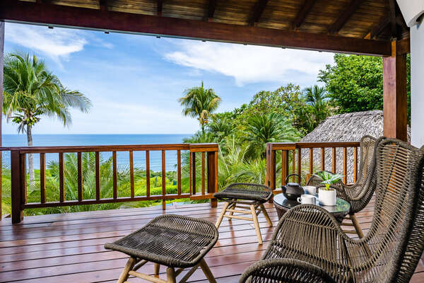 Step out onto your balcony to watch the ocean in its morning mist...