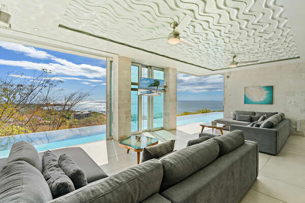 Jump In, Bliss Out!  Your living room, your gateway to the pool. Dive into Luxury and unwind with stunning ocean views