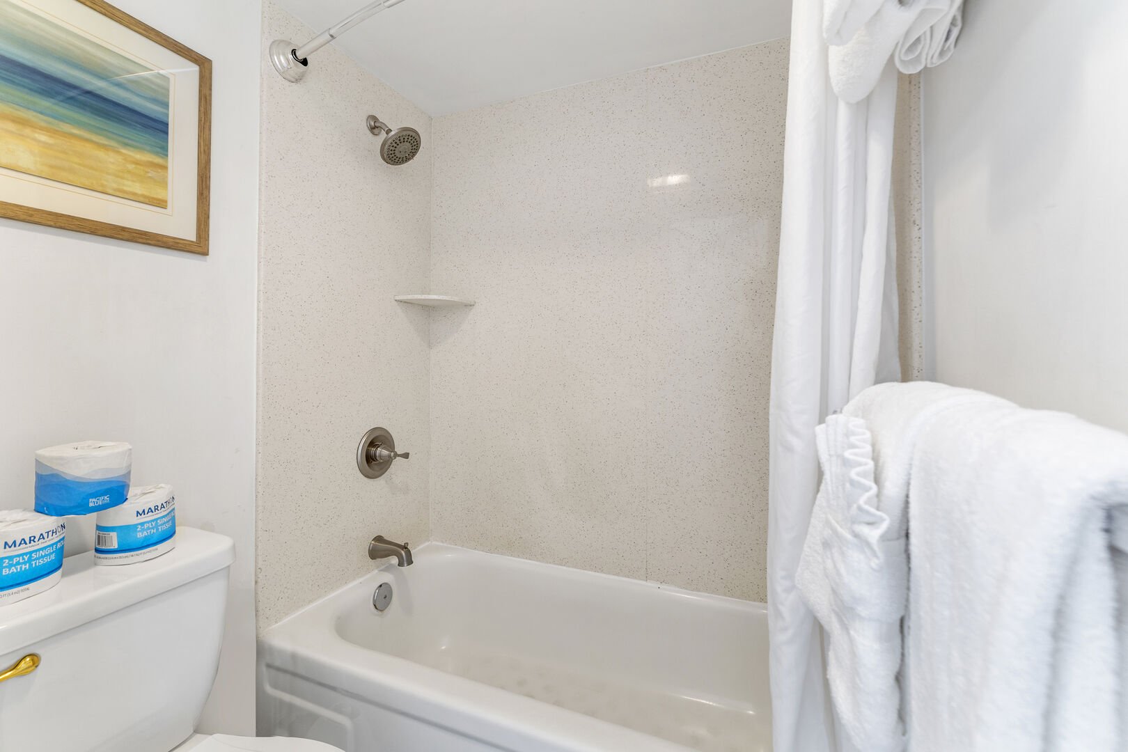The full bathroom has a shower and tub combination!