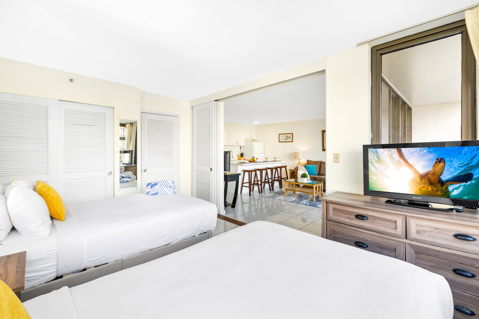 The bedroom features 2 full-size beds and a flat screen TV!