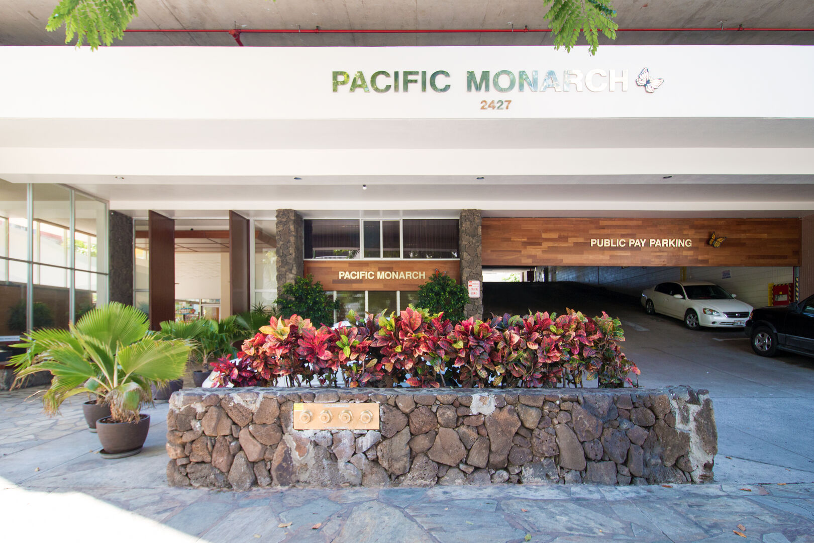 Pacific Monarch entrance on the left, paid public parking entrance on the right side