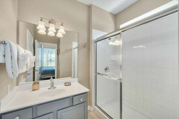 Ensuite bathroom with walk in shower and separate water closet