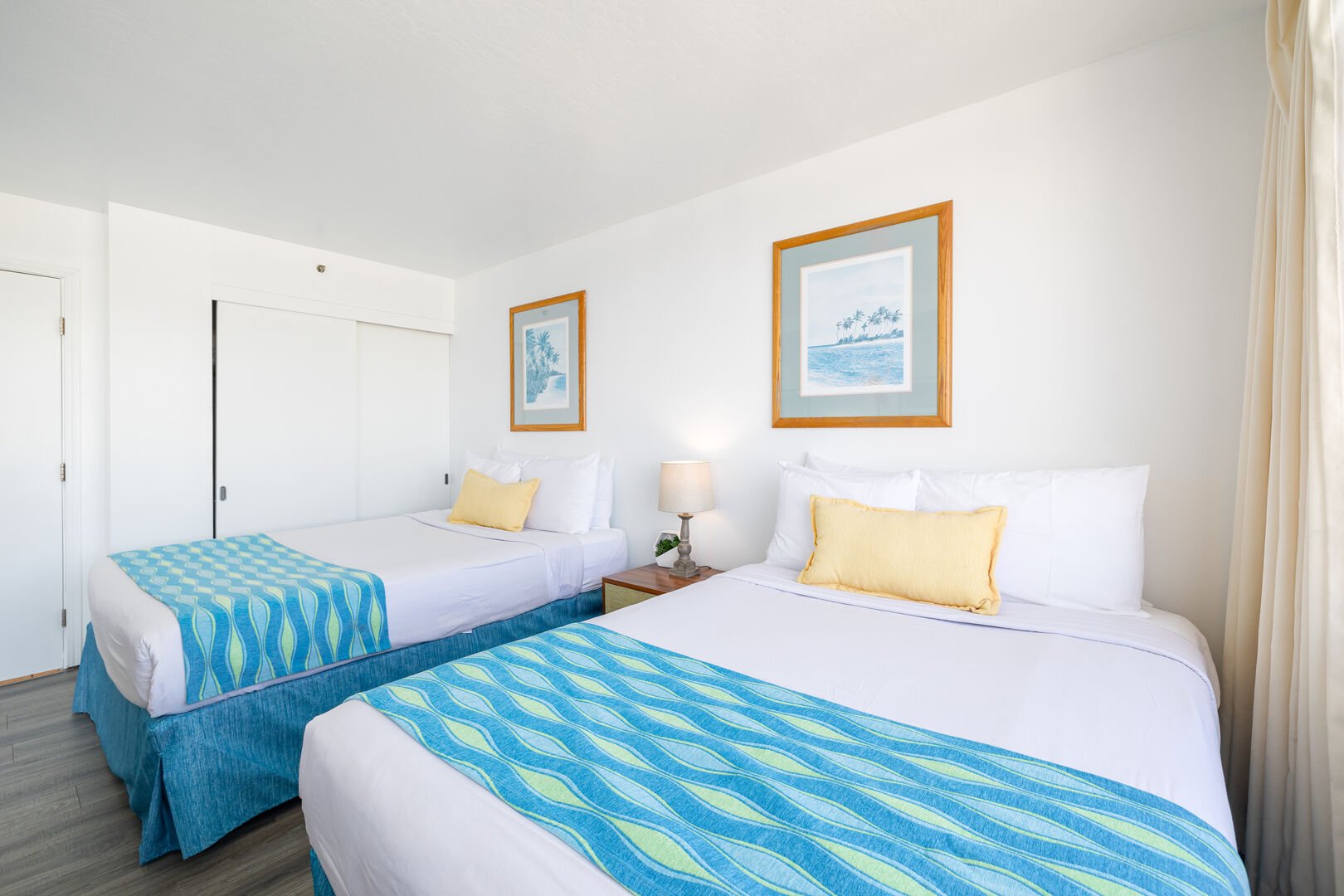 The bedroom features queen-size and full-size beds, nightstand, and closet!