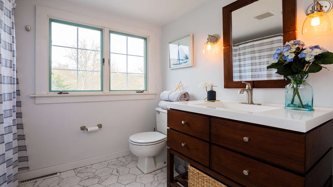 Full bath at top of stairs in hall.  790 Queen Anne Road Harwich- Cape Cod New England Vacation Rentals