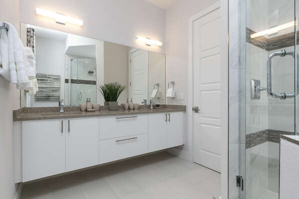 The ensuite bathroom has a gorgeous walk-in shower