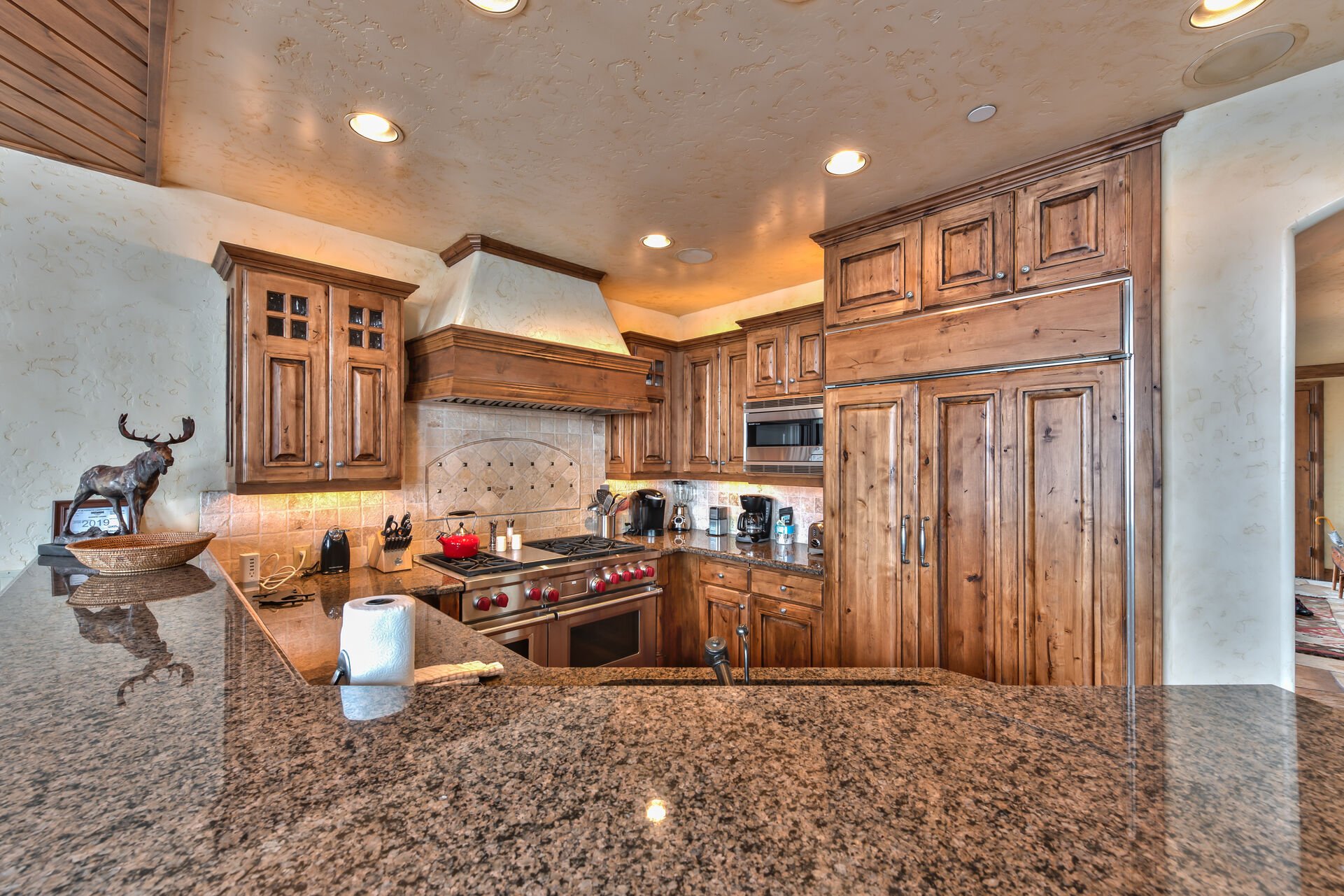 Chefs Kitchen with Stunning Cabinetry and Plenty of Counter Space for Meal Prep and Entertaining