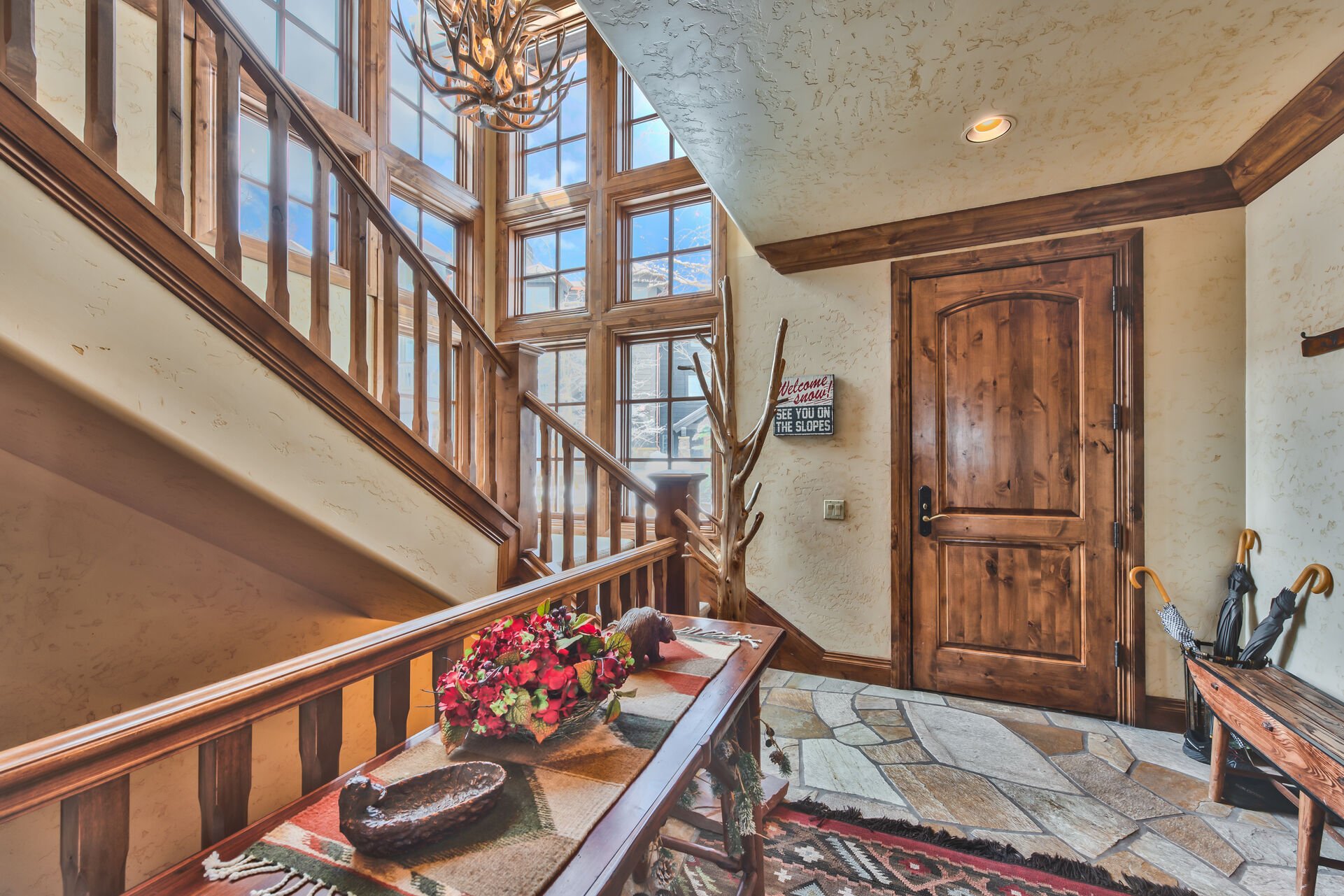 Stairway with Floor to Ceiling Windows with Mountain Views ty
