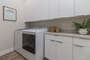 Main Floor Laundry room with large capacity washer/ dryer
