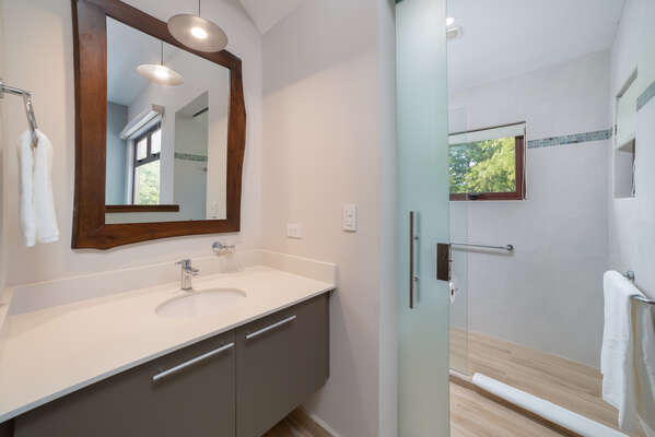 If you need a refreshing shower or a moment of privacy, the ensuite bathroom is right there for your convenience.