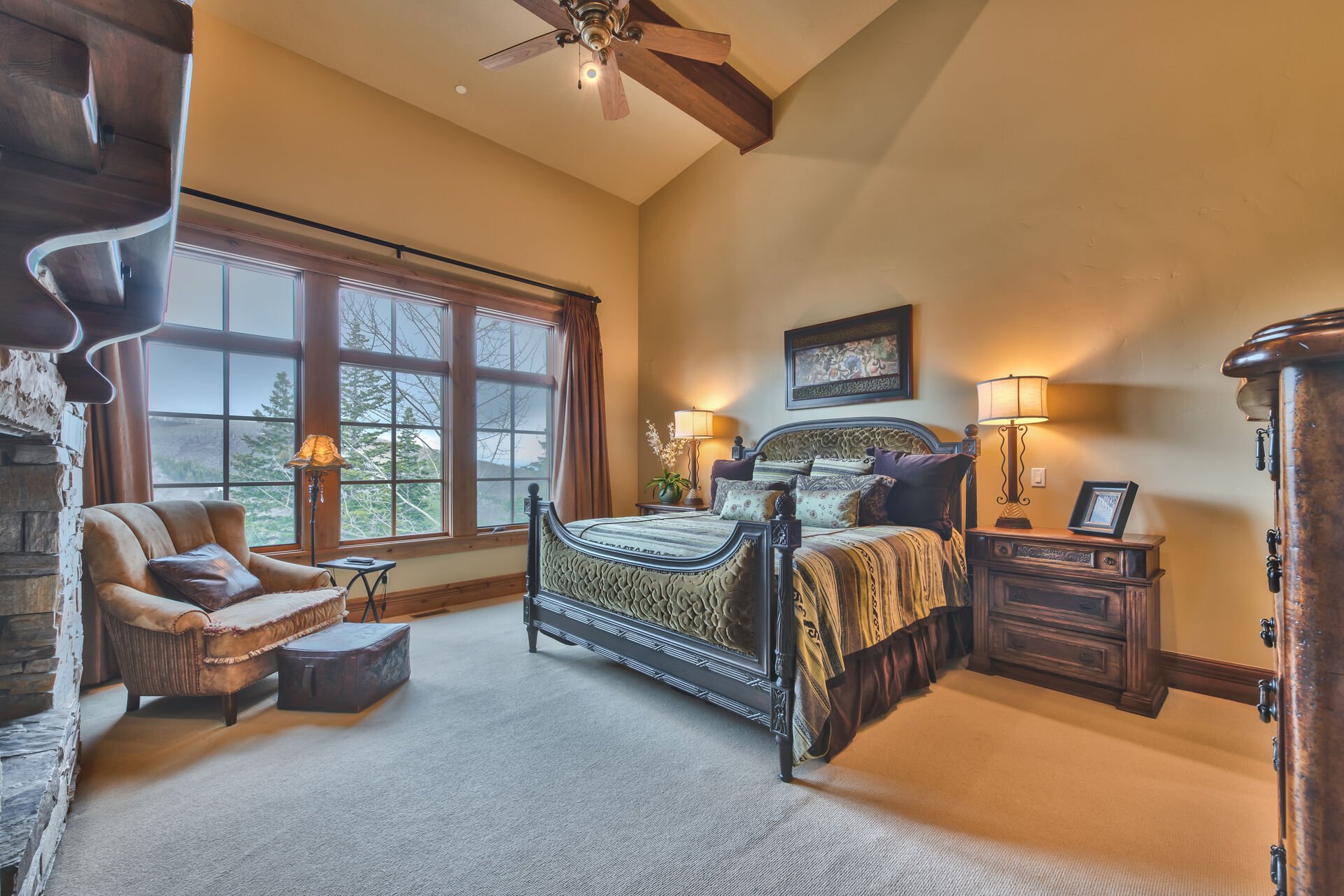 Main Level Grand Master Bedroom with a King Bed, 40'' HDTV, Private Bath, and Deer Valley Views