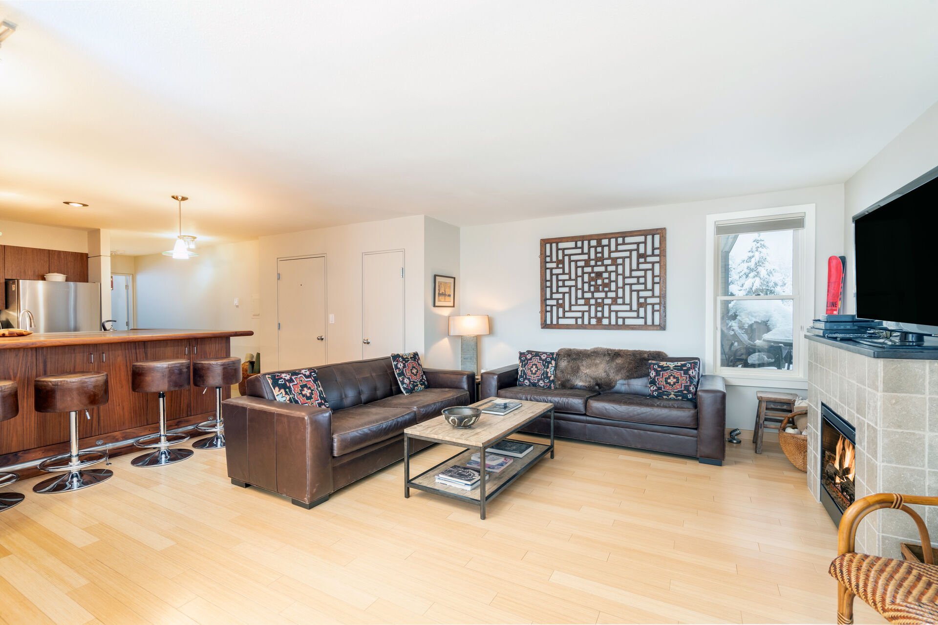 Living room with two couches and tv at this Telluride condo for rent.