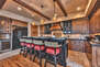 Chefs Kitchen with Stunning Cabinetry, Granite Counters, and Island/Bar with Seating for 4