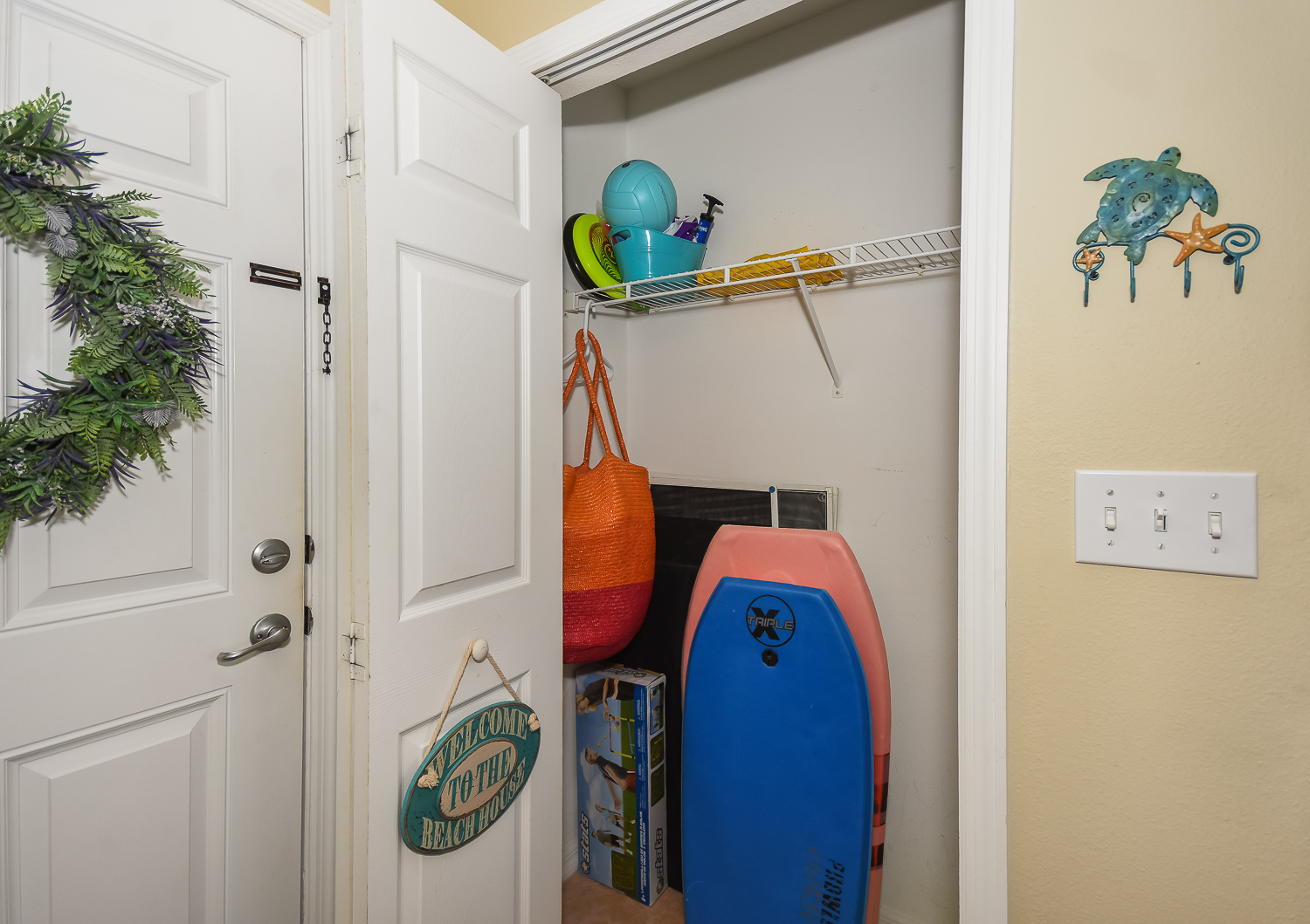 Closet with beach toys and equipment