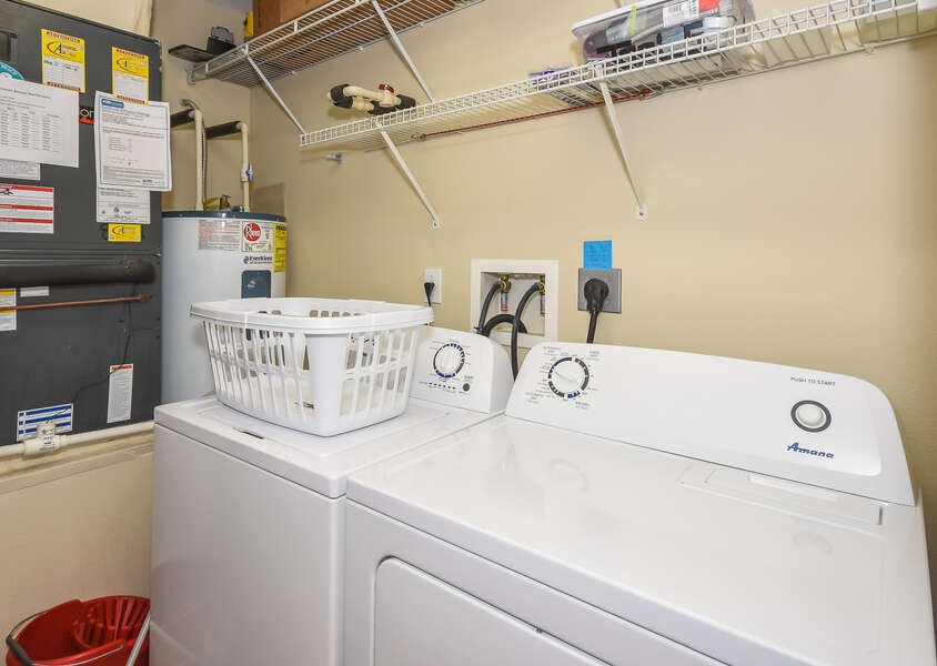 Laundry room with a full size washer and dryer