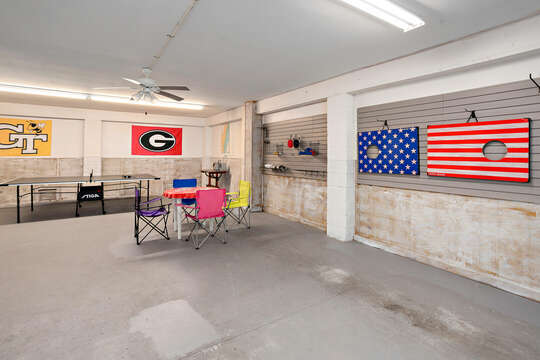 Garage area with plenty of room for ping pong, card games, cornhole and even park your vehicle!