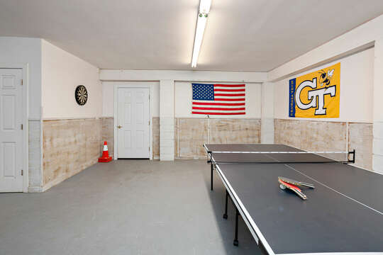 Garage area with plenty of room for ping pong, card games, cornhole and even park your vehicle