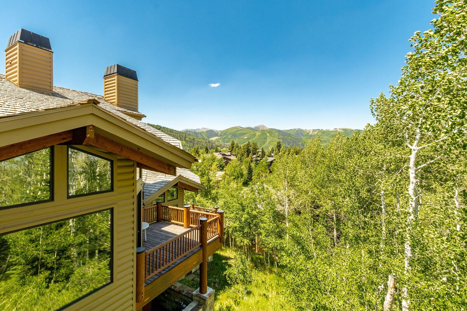 Upper deck off great room with clear views toward Deer Valley ski runs. Not pictured: natural gas firepit table, carved redwood lounge chairs, gas BBQ.