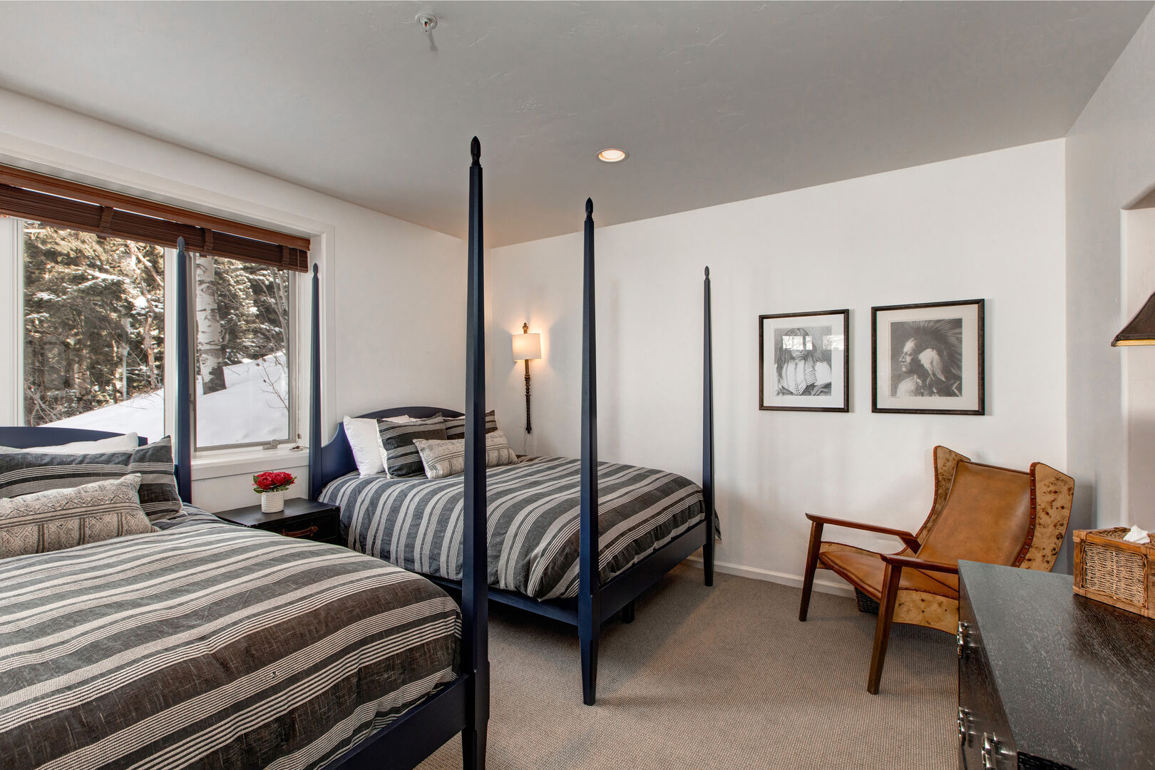 Lower level bedroom has matching four-poster queen beds; Wood blinds and spectacular western views from this end-unit townhome.