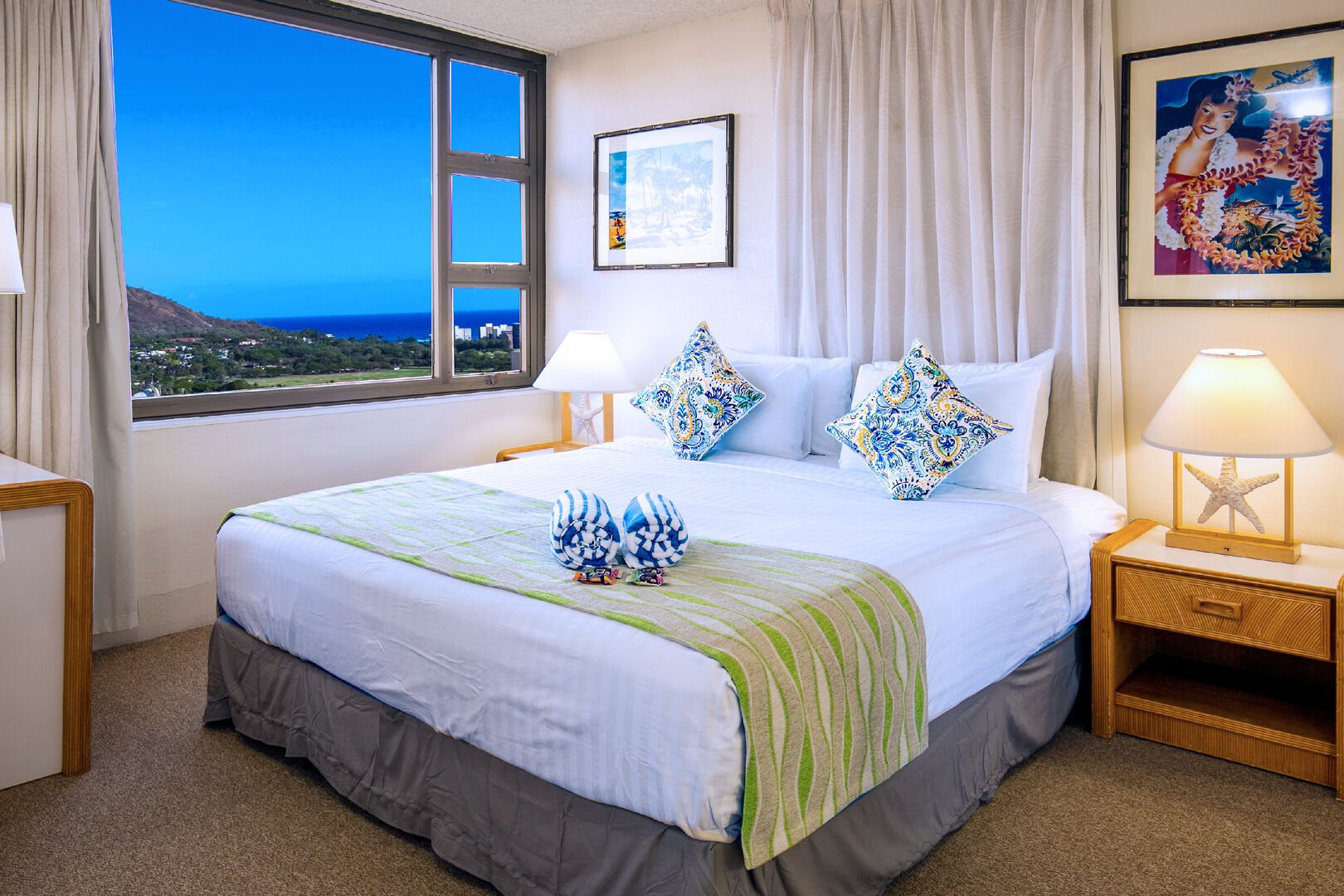 The bedroom features a king-size bed and Ocean and Diamond Head views.