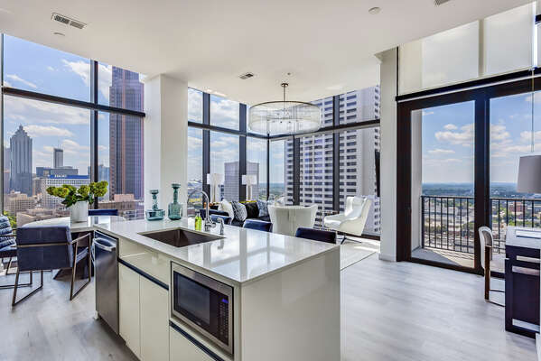Luxury Kitchen Overlooks Living and Dining Area.