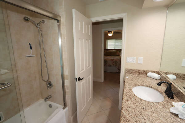 Guest bathroom and access to lanai