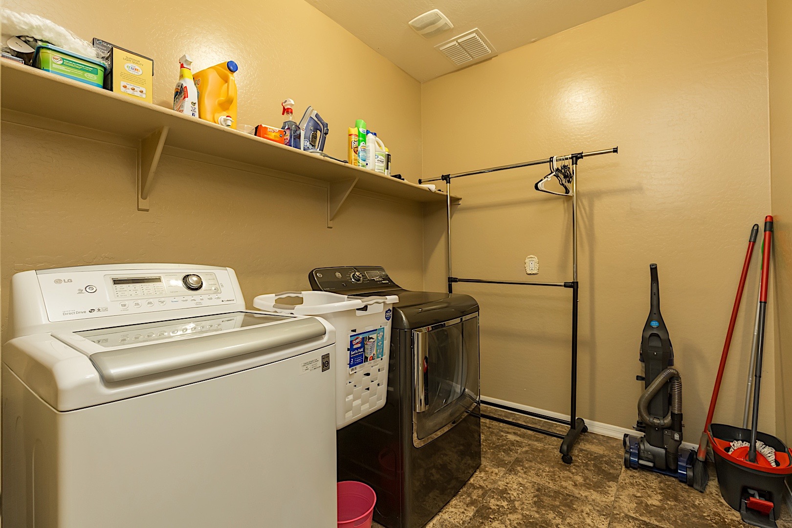 Inside laundry with full size washer and dryer