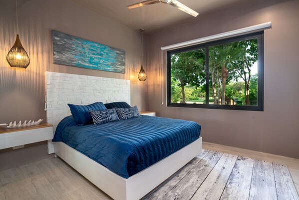 Next, let's go to Master Bedroom 2 where you'll find a comfy queen-size bed, inviting you to a restful night's sleep.